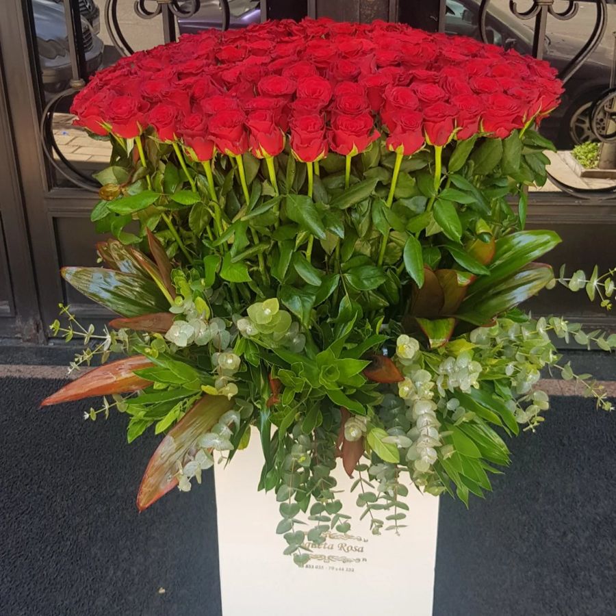 Tall rose arrangement in white box